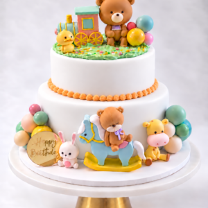 Teddy Bear Baby Shower Cake with pastel colors, choo-choo train, bunny, duckling and giraffe decorations